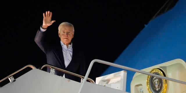 President Biden waves as he boards Air Force One at Andrews Air Force Base, Maryland, Tuesday, Dec. 27, 2022. Biden and his family are traveling to St. Croix in the US Virgin Islands to celebrate the New Year.