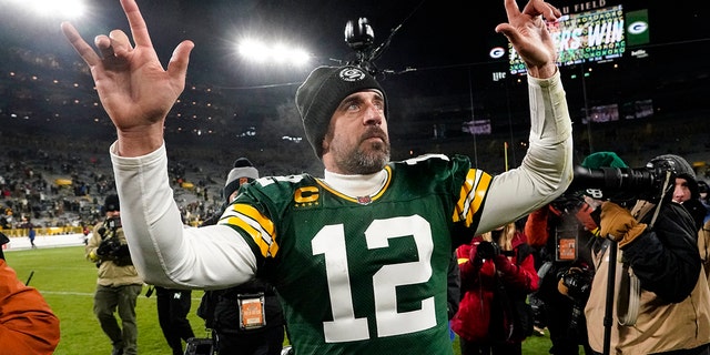 Green Bay Packers quarterback Aaron Rodgers waves to fans as he leaves the field following a game against the Los Angeles Rams at Lambeau Field in Green Bay, Wisconsin, on Dec. 19, 2022.