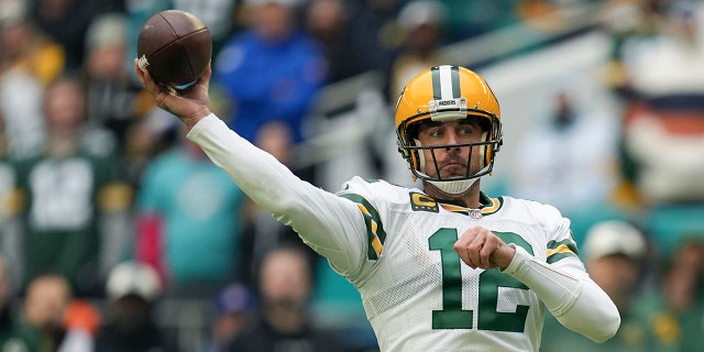 Green Bay Packers quarterback Aaron Rodgers (12) passes during the first half of an NFL football game against the Miami Dolphins, Sunday, Dec. 25, 2022, in Miami Gardens, Fla.