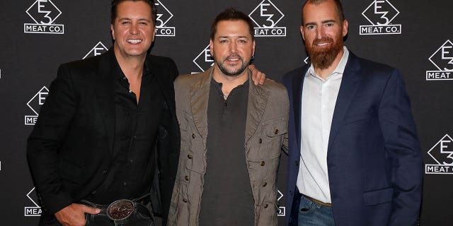 Luke Bryan (at left), Jason Aldean (center), and Adam LaRoche attend the grand opening of E3 Chophouse Nashville on Nov. 20, 2019 in Nashville, Tennessee. Bryan and LaRoche appeared on "Fox and Friends Weekend" on Sunday to discuss their efforts to help America's veterans through the E3 Ranch Foundation.