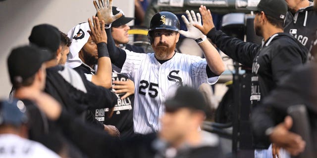 The Chicago White Sox's Adam LaRoche, #25, is congratulated by teammates after his two-run double in the first inning against the Toronto Blue Jays at U.S. Cellular Field in Chicago on Wednesday, July 8, 2015.