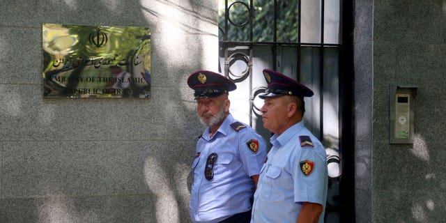 A cyberattack in September that temporarily disabled Albanian government digital services gave rise to Albania cutting diplomatic ties with Iran. Pictured are police officers walking in front of the Embassy of the Islamic Republic of Iran in Tirana on Sep. 7, 2022.