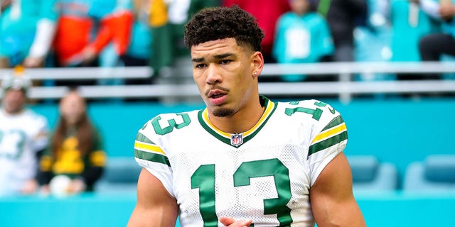 Allen Lazard #13 of the Green Bay Packers watches halftime during a game against the Miami Dolphins at Hard Rock Stadium in Miami Gardens, Florida on December 25, 2022.