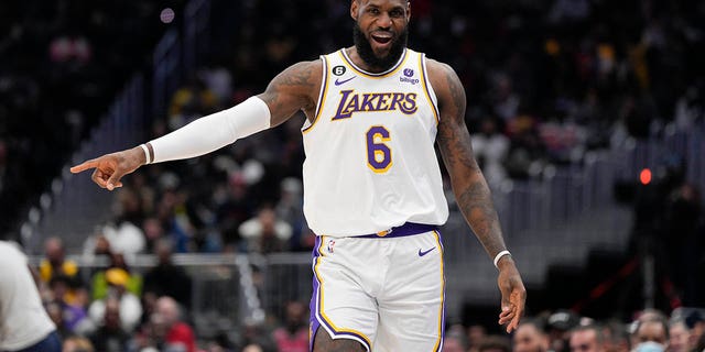 Los Angeles Lakers forward LeBron James (6) reacts after scoring against the Washington Wizards during the first half of an NBA basketball game, Sunday, Dec. 4, 2022, in Washington. 