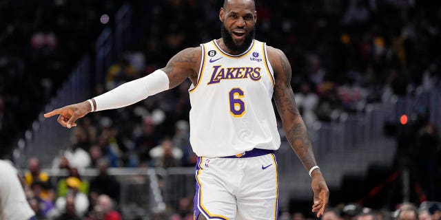 Los Angeles Lakers forward LeBron James (6) reacts after scoring against the Washington Wizards during the first half of an NBA basketball game, Sunday, Dec. 4, 2022, in Washington. 