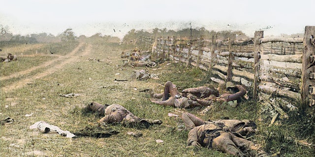 A colorized photograph of Confederate soldiers killed during the Battle of Antietam in 1862. Allen Guelzo believes that despite deep political divisions, 