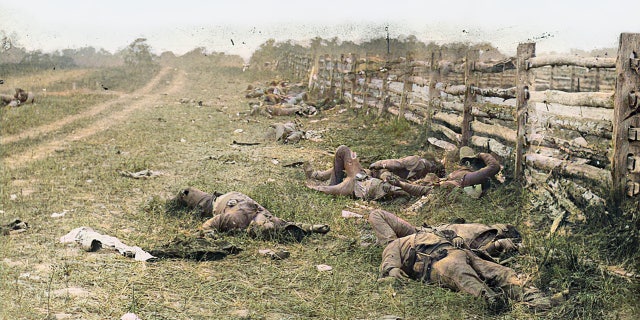 A colorized photograph of Confederate soldiers killed during the Battle of Antietam in 1862. Allen Guelzo believes that despite deep political divisions, "the fundamental unity of the American people" is stronger now than when Southern states seceded in 1861.