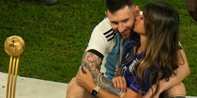 Lionel Messi celebrates with his wife Antonela Roccuzzo after Argentina won the World Cup over France in Lusail, Qatar on December 18, 2022.