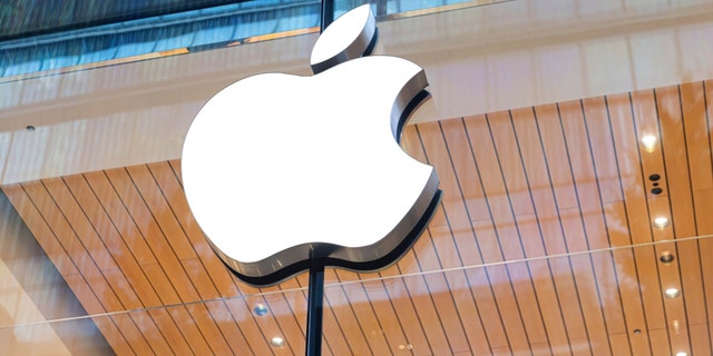 The Apple logo is seen above the entrance of the Apple Store in Tokyo on October 20, 2022.