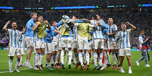 LUSAIL CITY, QATAR - DECEMBER 09: Argentina players celebrate after their win in the penalty shootout during the FIFA World Cup Qatar 2022 quarter final match between Netherlands and Argentina at Lusail Stadium on December 09, 2022 in Lusail City, Qatar.