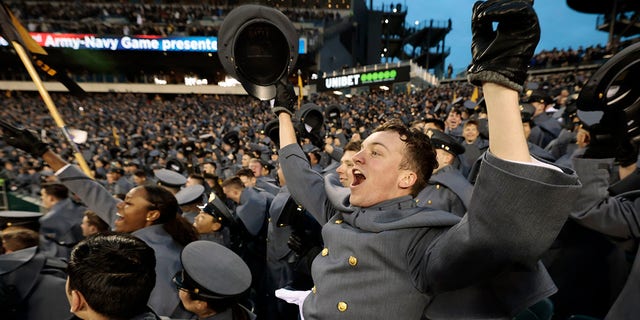 Army Cadet Cpl. Andrew Sanchez of Carmel, Ind., celebrates when Army takes the lead 7-3 in the second quarter in Philadelphia, Saturday, Dec. 10, 2022.