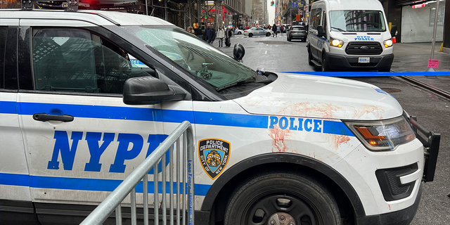 NYPD SUV covered in blood after a man was stabbed in Times Square on New Year's Eve.