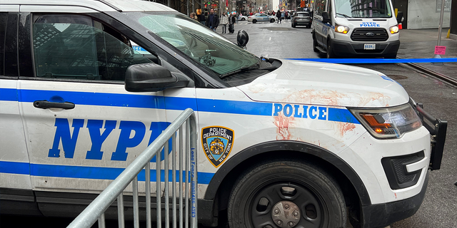 NYPD SUV covered in blood after a man was stabbed in Times Square on New Year's Eve.