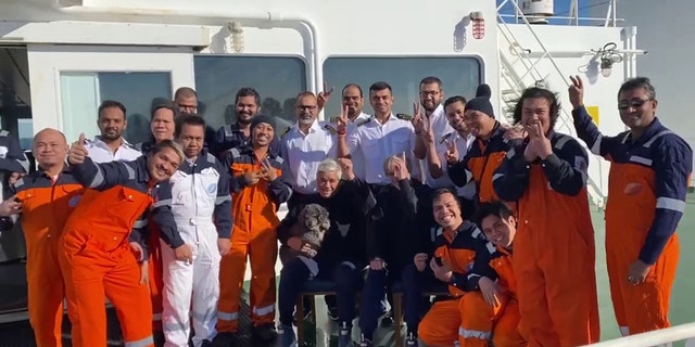 The crew from the Hong Kong-flagged tanker, Silver Muna, recovers two men and their dog that were aboard a sailboat that had been adrift for several days in the Atlantic Ocean, Dec. 13 2022. 
