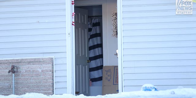 A shower curtain inside the home where the University of Idaho quadruple homicide occurred in Moscow, Idaho, is visible through an open door on Wednesday. A neighbor told Fox News that the same door was wide open the morning of the murders, hours after they took place and hours before police arrived.