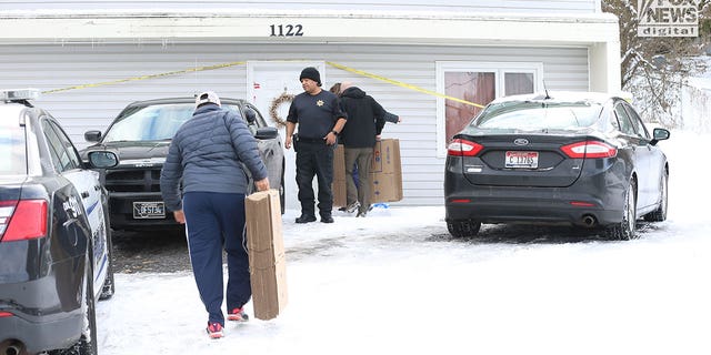The belongings of the victims of the University of Idaho quadruple homicide are removed from the house in Moscow, Idaho, Dec. 7, 2022.