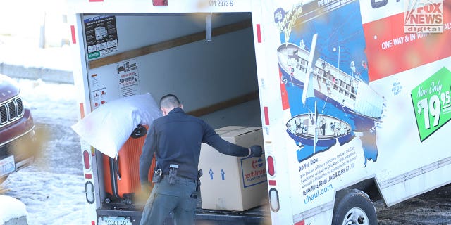 The belongings of the victims of the University of Idaho quadruple homicide are removed from the house in Moscow, Idaho, Wednesday, December 7, 2022.