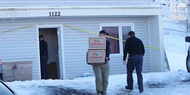 The belongings of the victims of the University of Idaho quadruple homicide are removed from the house in Moscow, Idaho, on Dec. 7, 2022.