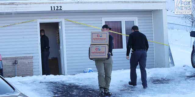 The belongings of the victims of the Univeristy of Idaho quadruple homicide are removed from the house in Moscow, Idaho, Wednesday, December 7, 2022.