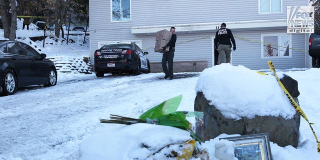 The belongings of victims of the University of Idaho quadruple homicide are removed from the home in Moscow, Idaho, Wednesday, Dec. 7, 2022.
