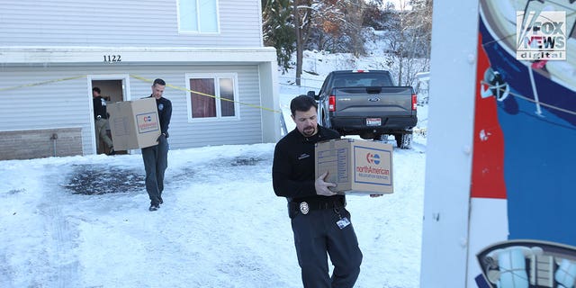 The belongings of the victims of the Univeristy of Idaho quadruple homicide are removed from the house in Moscow, Idaho, Wednesday, December 7, 2022.