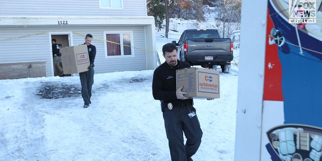 The belongings of the victims of the Univeristy of Idaho quadruple homicide are removed from the house in Moscow, Idaho, Wednesday, December 7, 2022.