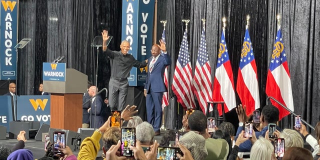 Former President Barack Obama joins Democratic Sen. Raphael Warnock of Georgia for a rally on Dec. 1, 2022 in Atlanta, Georgia. Warnock is facing off with Republican challenger Herschel Walker on Dec. 6 in a Senate runoff election.