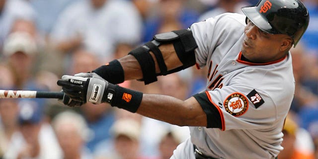 San Francisco Giants' Barry Bonds hits a single against the Chicago Cubs during the third inning of a game, July 19, 2007, in Chicago.