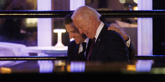President Biden and Emmanuel Macron, France's president, depart after dining at the Fiola Mare restaurant in Washington, D.C., on Wednesday, Nov. 30, 2022.