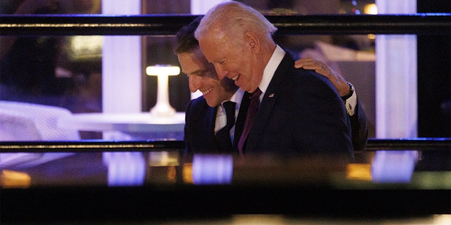 President Biden and Emmanuel Macron, France's president, depart after dining at the Fiola Mare restaurant in Washington, D.C., on Wednesday, Nov. 30, 2022.