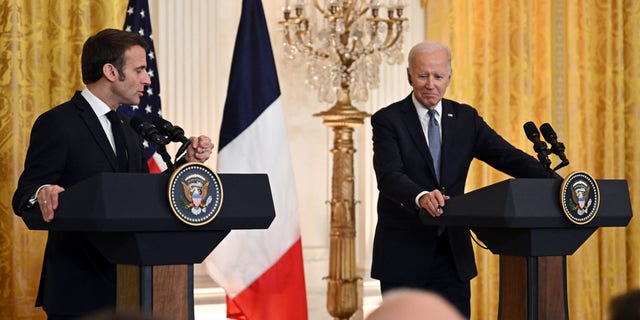 President Biden and French President Emmanuel Macron talk to reporters at the White House on Dec. 1, 2022.