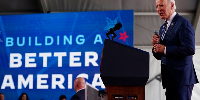 President Biden speaks about his economic agenda after touring the building site for a new computer chip plant for Taiwan Semiconductor Manufacturing Company in Phoenix, Arizona.