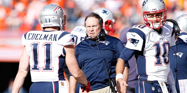 Head coach Bill Belichick of the New England Patriots speaks to Julian Edelman #11 in the first half against the Denver Broncos in the AFC Championship game at Sports Authority Field at Mile High on January 24, 2016 in Denver, Colorado.