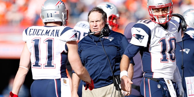 Head coach Bill Belichick of the New England Patriots speaks to Julian Edelman #11 in the first half against the Denver Broncos in the AFC Championship game at Sports Authority Field at Mile High on January 24, 2016 in Denver, Colorado.