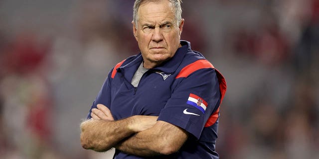 New England Patriots head coach Bill Belichick looks on prior to the game against the Arizona Cardinals at State Farm Stadium on Dec. 12, 2022 in Glendale, Arizona.