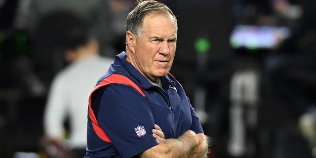 New England Patriots head coach Bill Belichick prepares for a game against the Cardinals at State Farm Stadium on December 12, 2022 in Glendale, Arizona.
