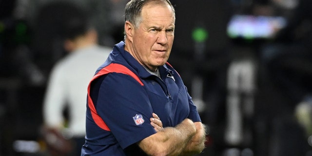 New England Patriots head coach Bill Belichick prepares for a game against the Cardinals at State Farm Stadium on December 12, 2022 in Glendale, Arizona.