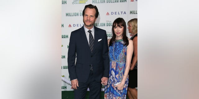 The late actor Bill Paxton and wife Louise Newbury attend the premiere of Disney's "Million Dollar Arm" on May 6, 2014.