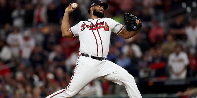 Kenley Jansen of the Atlanta Braves delivers a pitch against the Philadelphia Phillies during the ninth inning in Game 2 of a National League Division Series at Truist Park Oct. 12, 2022, in Atlanta.
