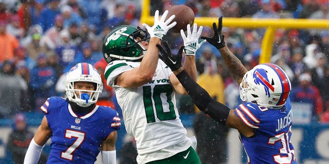 New York Jets wide receiver Braxton Berrios (10) reaches for the ball during the second half, Sunday, Dec. 11, 2022, in Orchard Park, New York.
