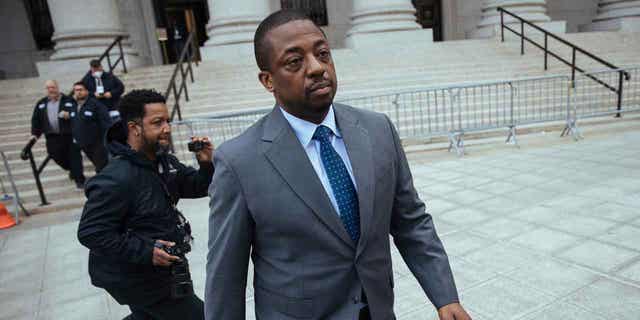 Former New York Lieutenant Gov. Brian Benjamin leaves a hearing in federal court on April 18, 2022, in New York. A judge has thrown out bribery and fraud charges against Benjamin, leaving him facing only records falsification charges.