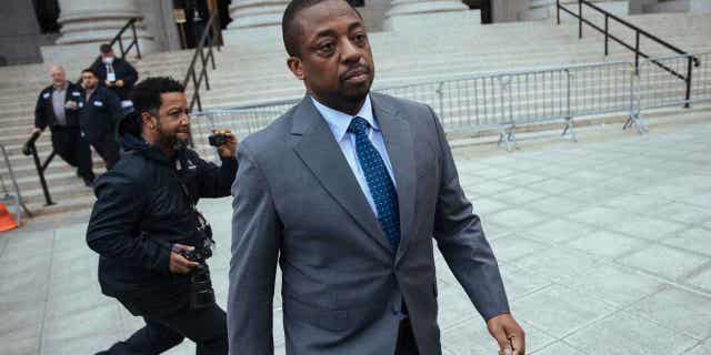 Former New York Lieutenant Gov. Brian Benjamin leaves a hearing in federal court on April 18, 2022, in New York. A judge has thrown out bribery and fraud charges against Benjamin, leaving him facing only records falsification charges.