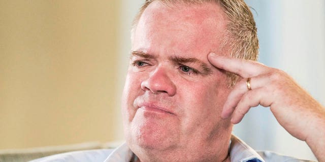 Brian Lilly cries while speaking about his son, Brian Lilly Jr., during an interview with The Associated Press, Thursday, Oct. 13, 2022, in Easton, Connecticut.