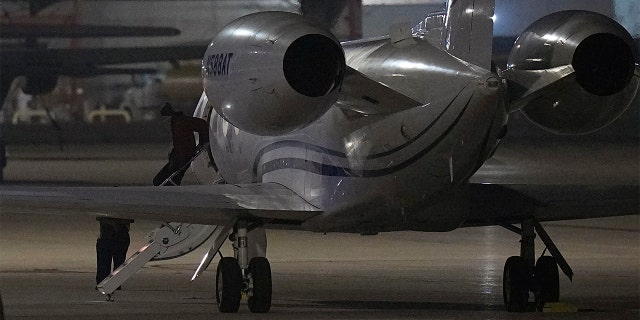 WNBA star Brittney Griner deplanes at Kelly Field in San Antonio Friday, Dec. 9, 2022 following her release in a prisoner swap with Russia.