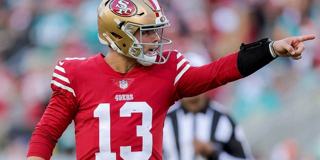 San Francisco 49ers quarterback Brock Purdy celebrates after throwing a touchdown pass against the Miami Dolphins, Dec. 4, 2022.