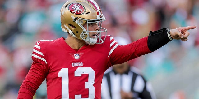 San Francisco 49ers quarterback Brock Purdy celebrates after throwing a touchdown pass against the Miami Dolphins, Dec. 4, 2022.