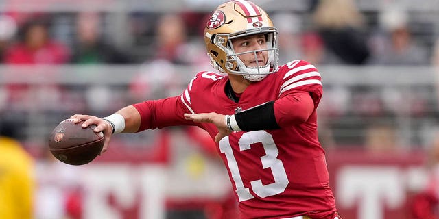 San Francisco 49ers quarterback Brock Purdy throws a touchdown pass during the first half against the Tampa Bay Buccaneers in Santa Clara, California, Sunday, Dec. 11, 2022.