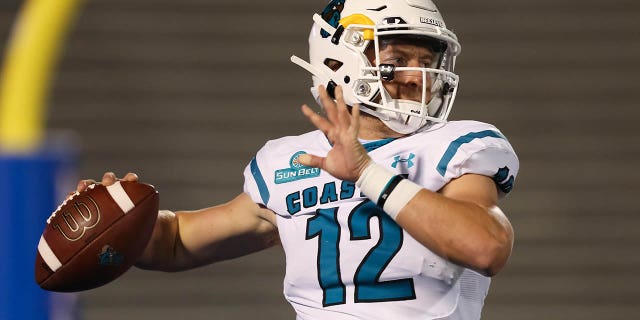 Coastal Carolina Chanticleers quarterback Bryce Carpenter throws a pass in warmups before a college football game between the Coastal Carolina Chanticleers and Kansas Jayhawks on September 12, 2020, at Memorial Stadium in Lawrence, KS.