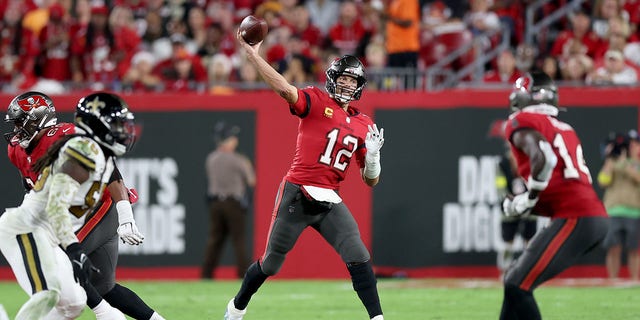 TAMPA, FLORIDA - DECEMBER 5: Tom Brady, #12 of the Tampa Bay Buccaneers, throws a pass against the New Orleans Saints during the third quarter in the game at Raymond James Stadium on December 5, 2022, in Tampa, Florida.