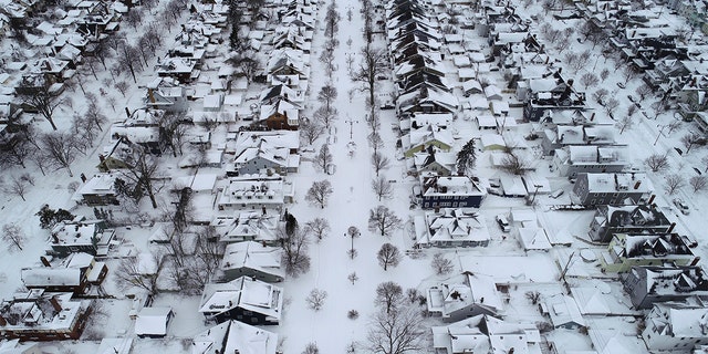 Fordham Avenue, center, and the 1901 Pan-American Exposition neighborhood of Buffalo, N.Y. is coated in a blanket of snow after the blizzard, Tuesday, Dec. 27, 2022. 